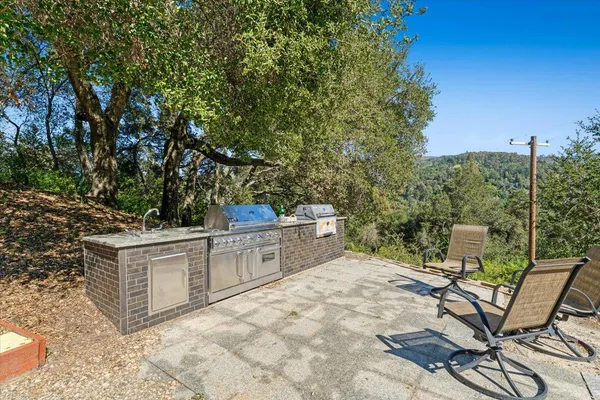 a picture of a kitchen with a refrigerator and a stove