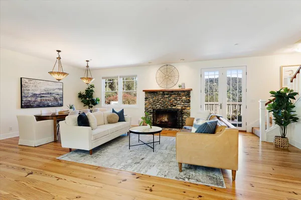 a dining room with furniture and window