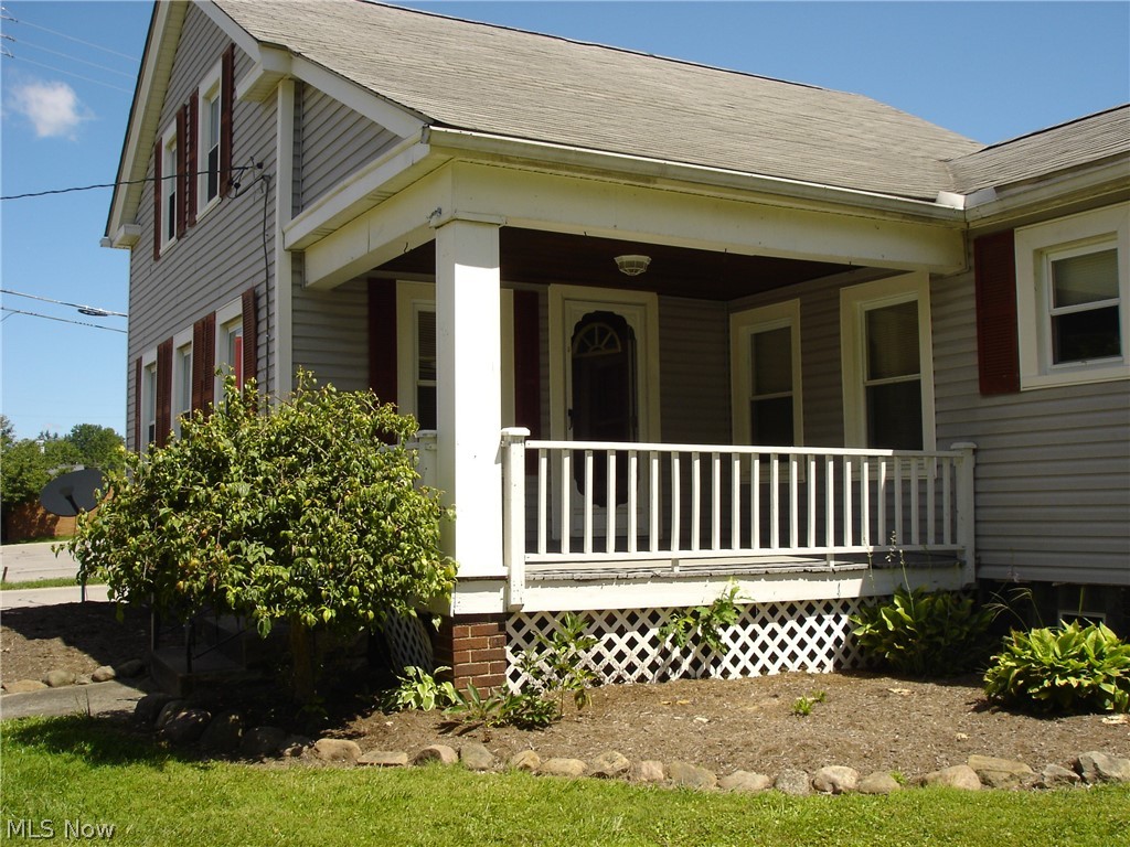 77 South Maple State Road Orwell, OH 44076 - Photo 2 of 30 Large front covered porch