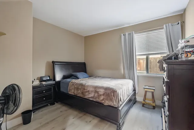 a bedroom with a bed and a closet