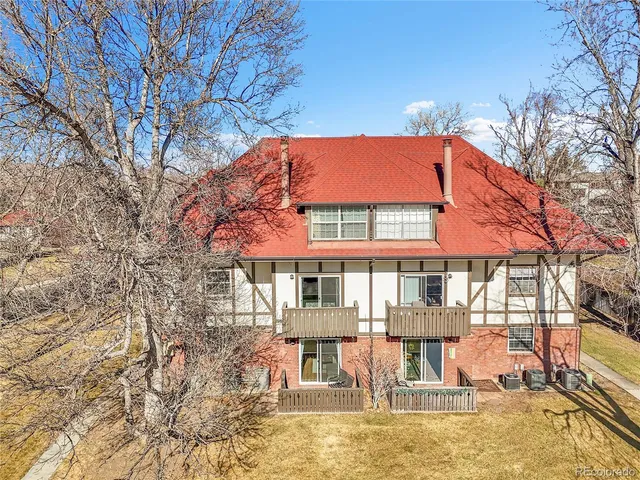 an aerial view of residential house and car parked