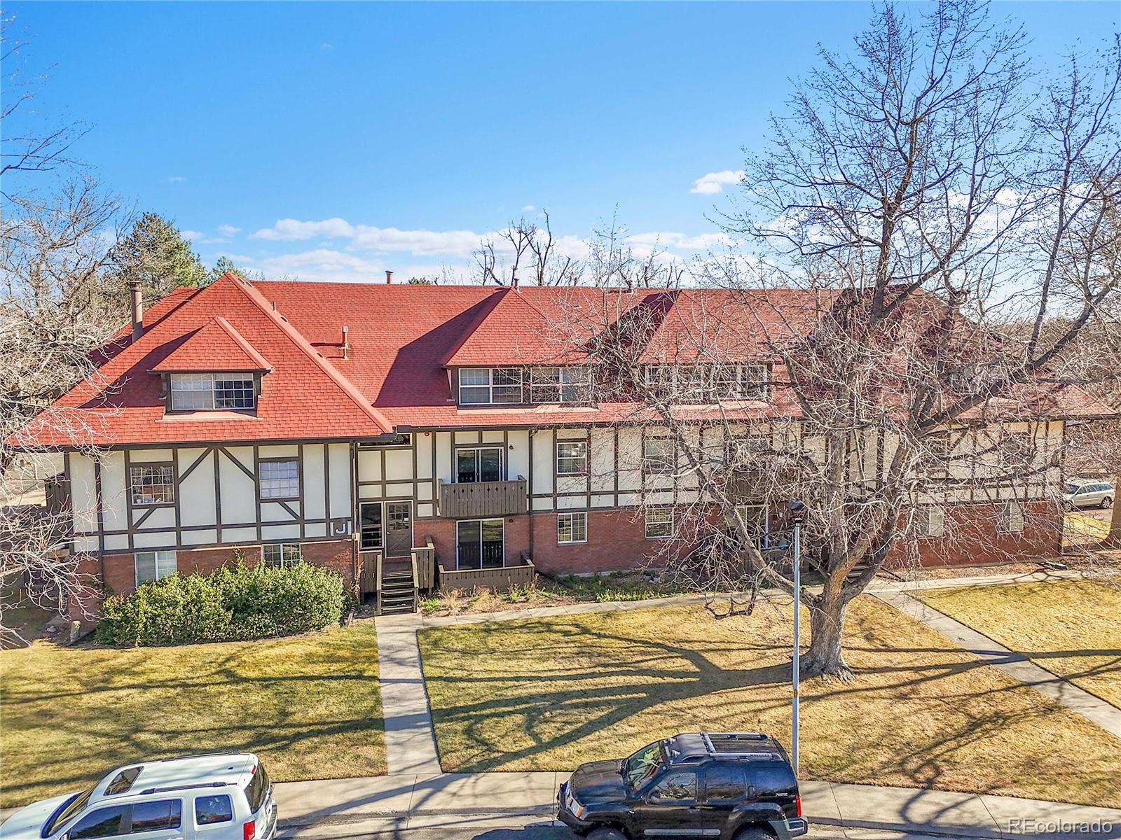 3250 Oneal Circle, Unit 25J Boulder, CO 80301 - Photo 3 of 22 a view of residential houses with yard and swimming pool