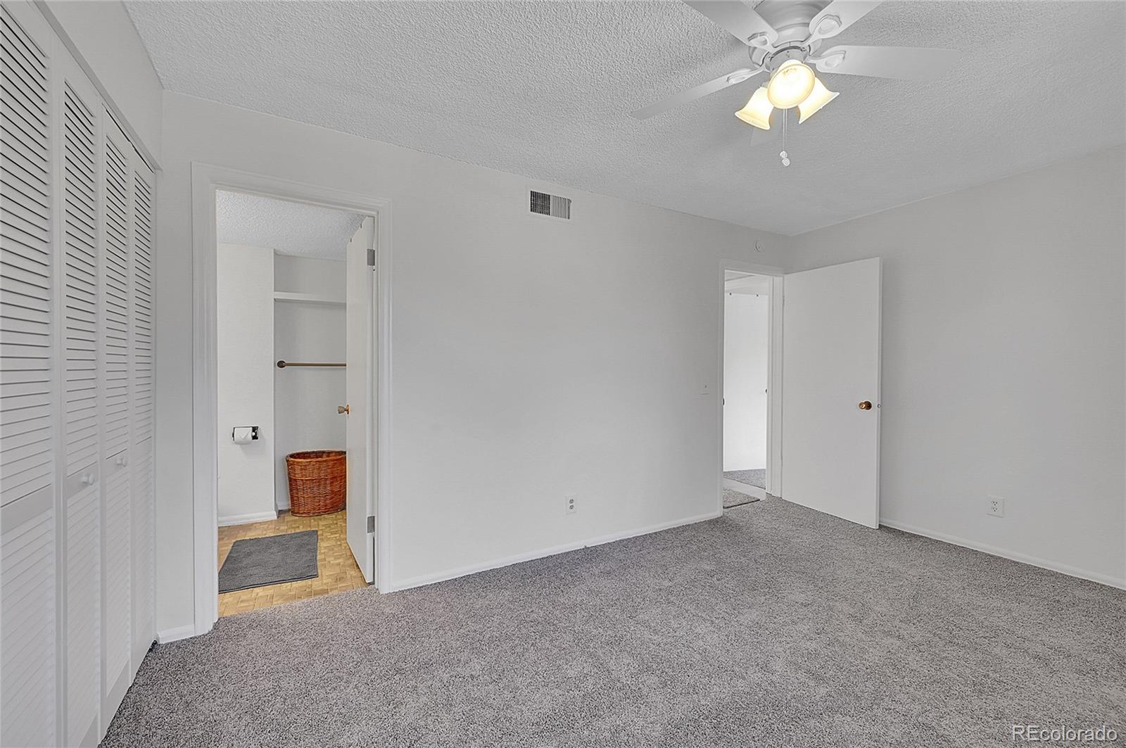 3250 Oneal Circle, Unit 25J Boulder, CO 80301 - Photo 8 of 22 a view of empty room with a ceiling fan