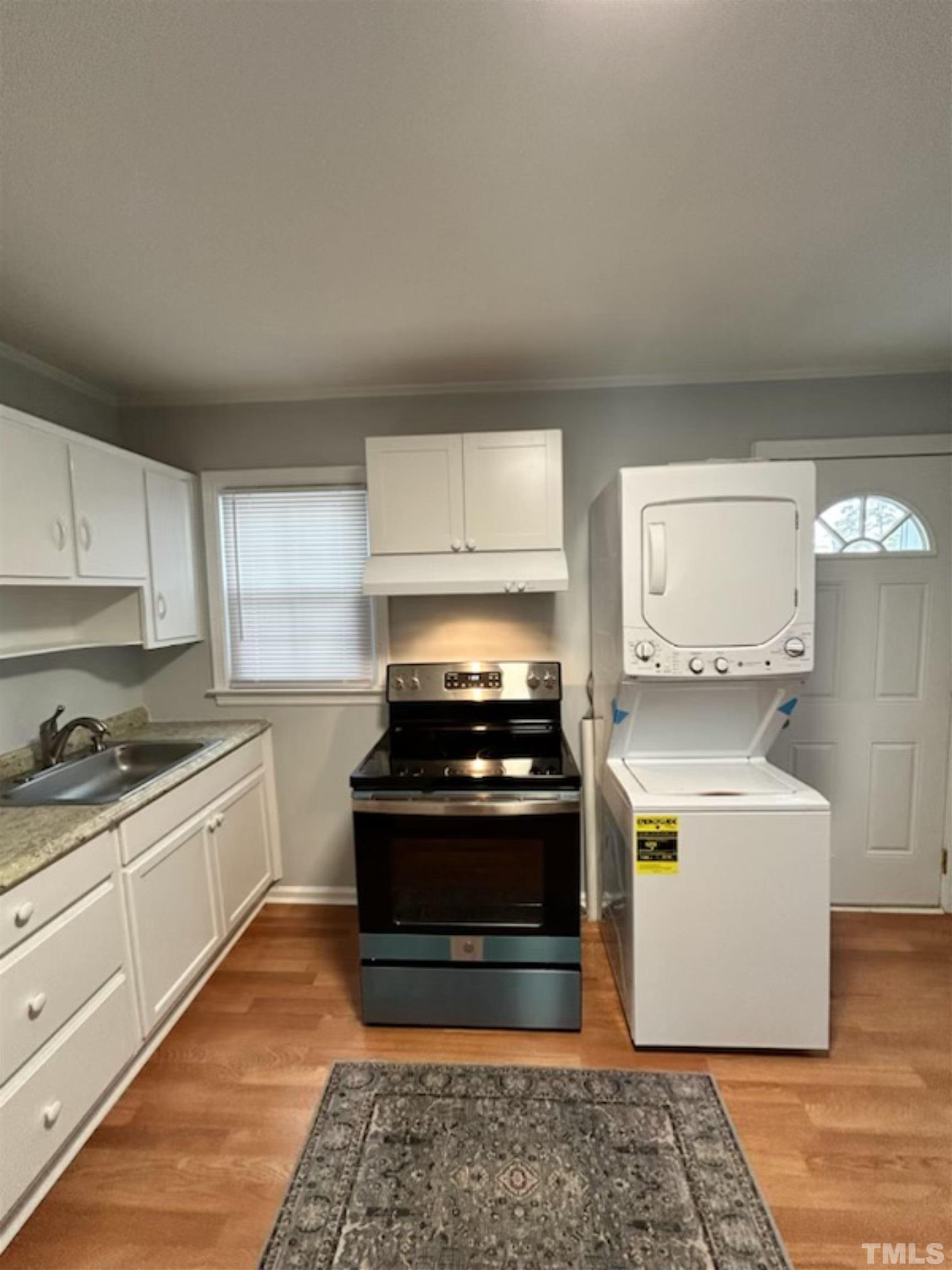 1717 Bennett Street Raleigh, NC 27604 - Photo 11 of 15 a kitchen with a stove and a sink