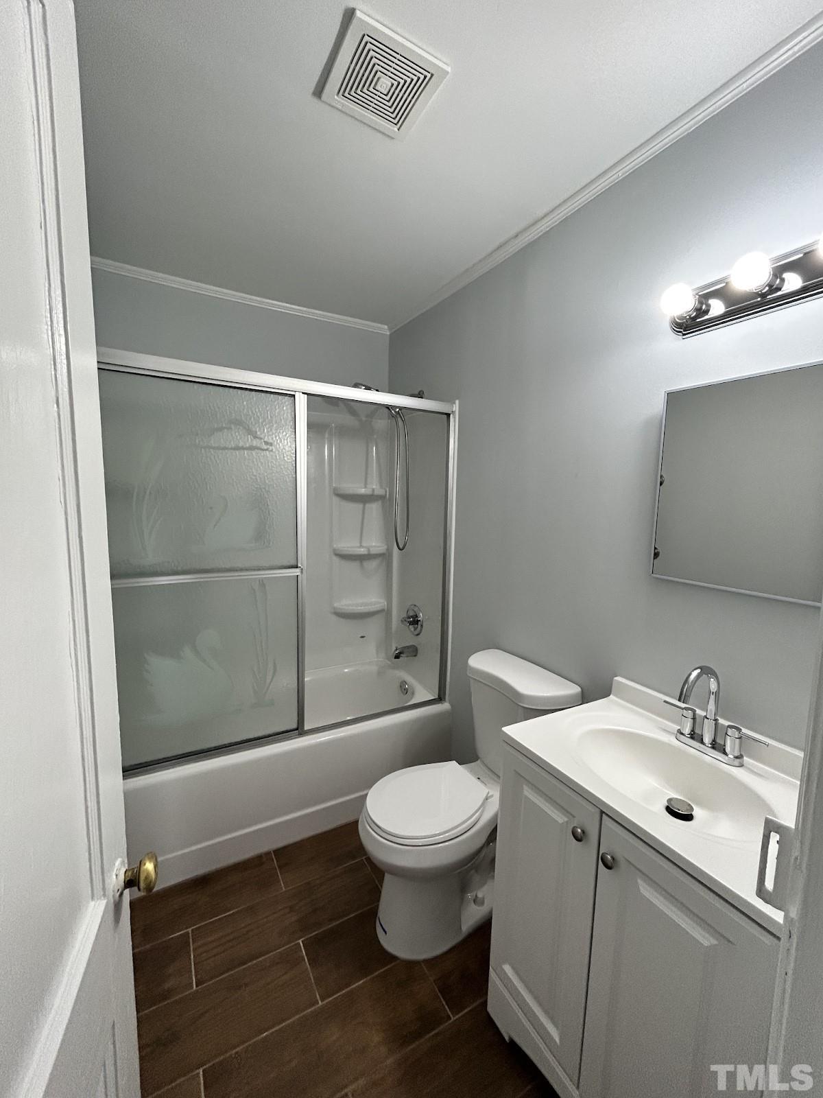 1717 Bennett Street Raleigh, NC 27604 - Photo 6 of 15 a bathroom with a toilet a sink and shower