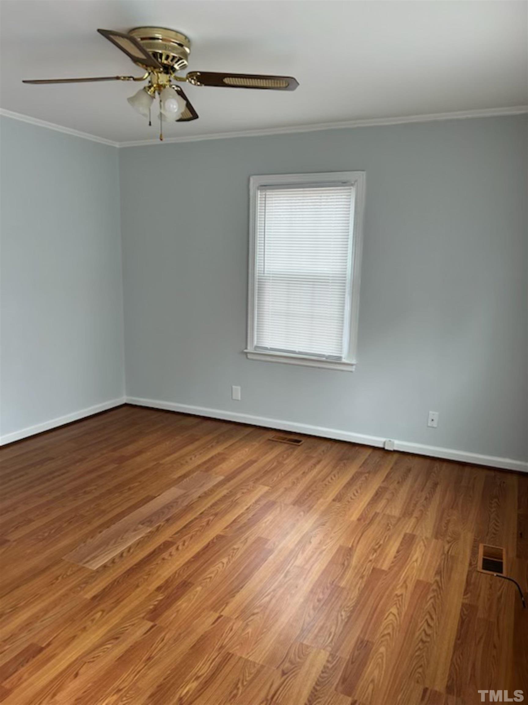 1717 Bennett Street Raleigh, NC 27604 - Photo 7 of 15 wooden floor in an empty room with a window