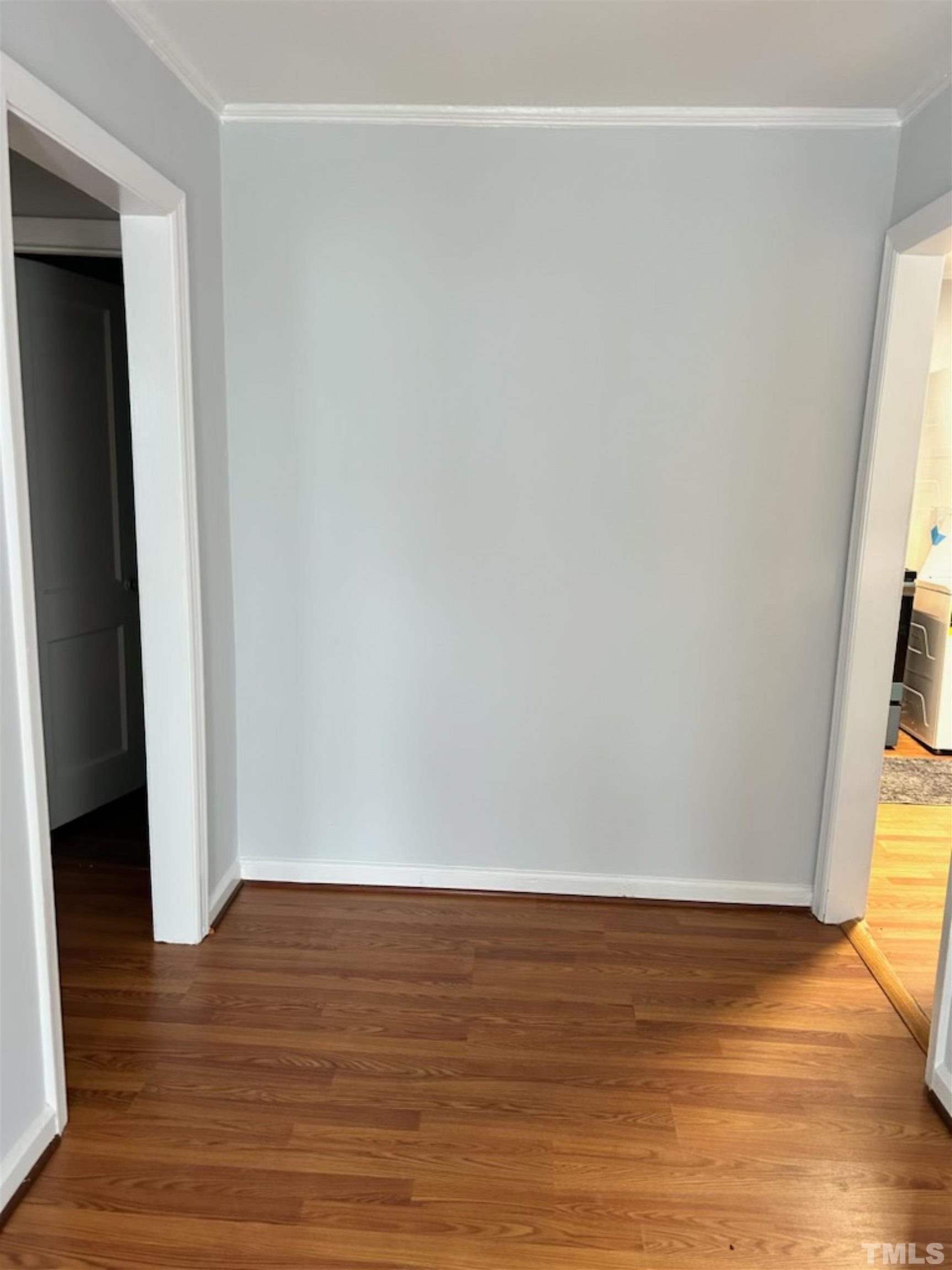 1717 Bennett Street Raleigh, NC 27604 - Photo 8 of 15 a view of an empty room with wooden floor and a window