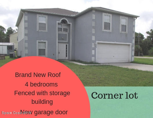 1006 Ray Road Southeast Palm Bay, FL 32909 - Photo 1 of 21 a sign on the side of the road