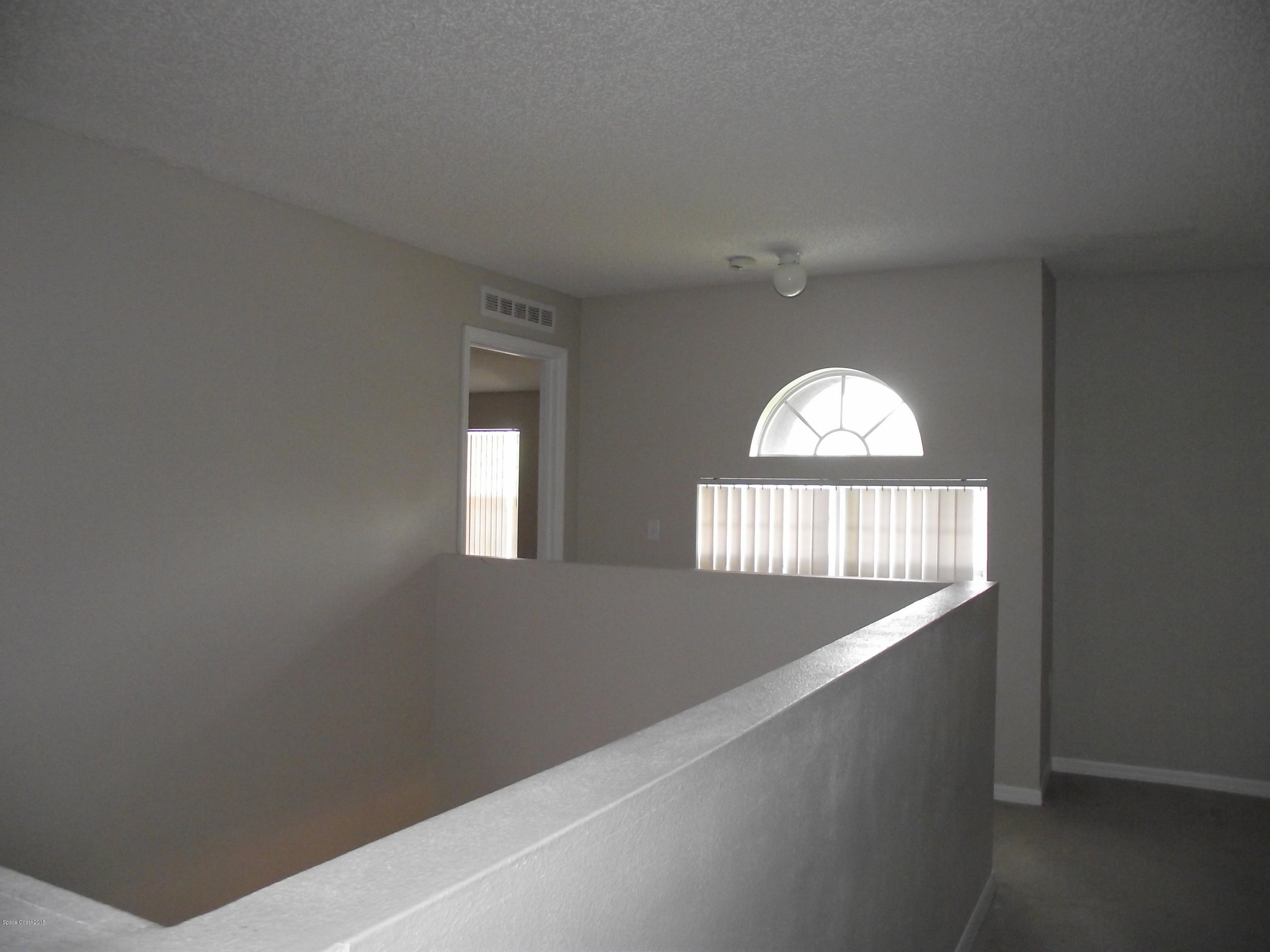 1006 Ray Road Southeast Palm Bay, FL 32909 - Photo 11 of 21 an empty room with a window