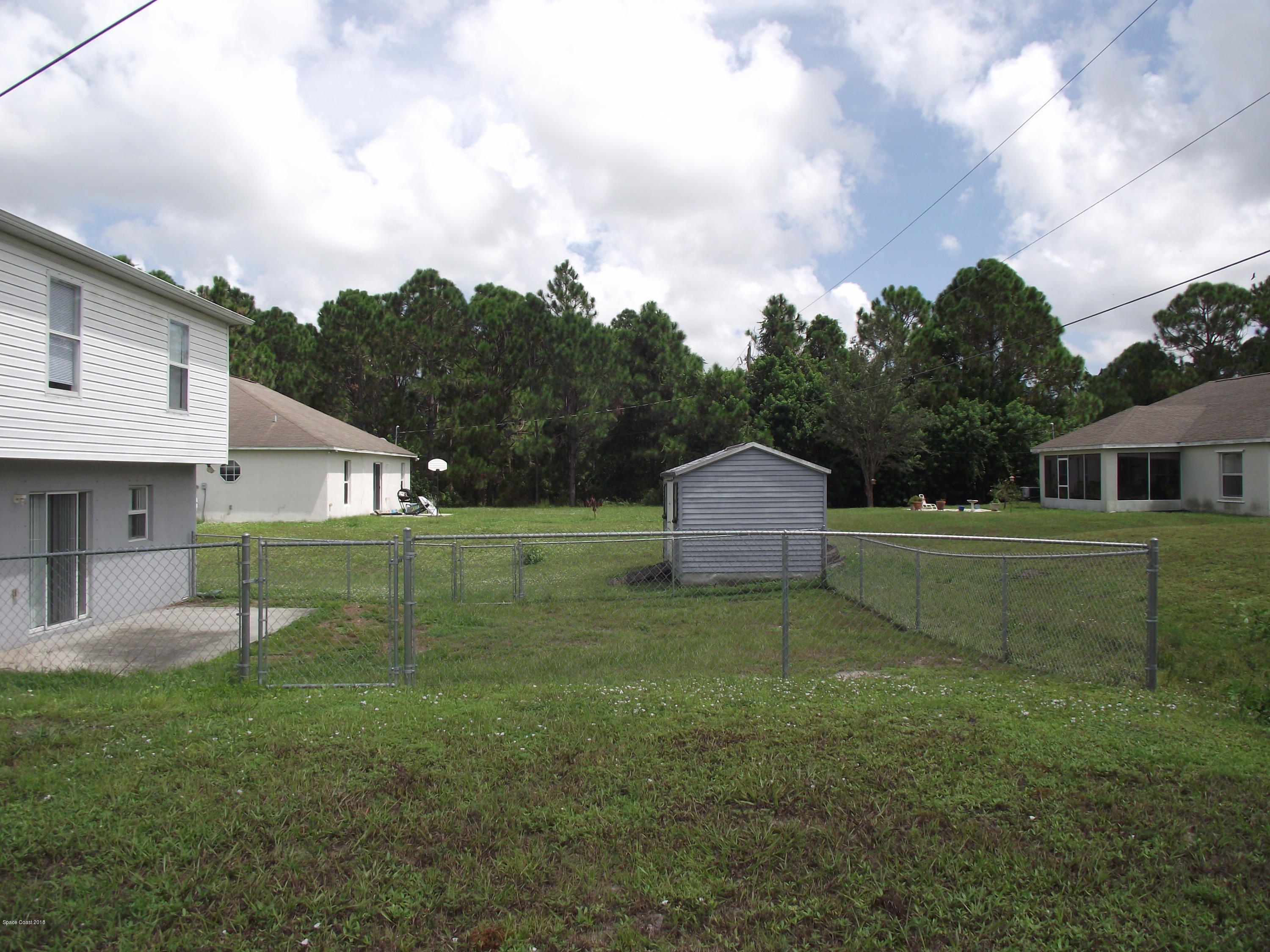 1006 Ray Road Southeast Palm Bay, FL 32909 - Photo 21 of 21 a view of a house with a yard