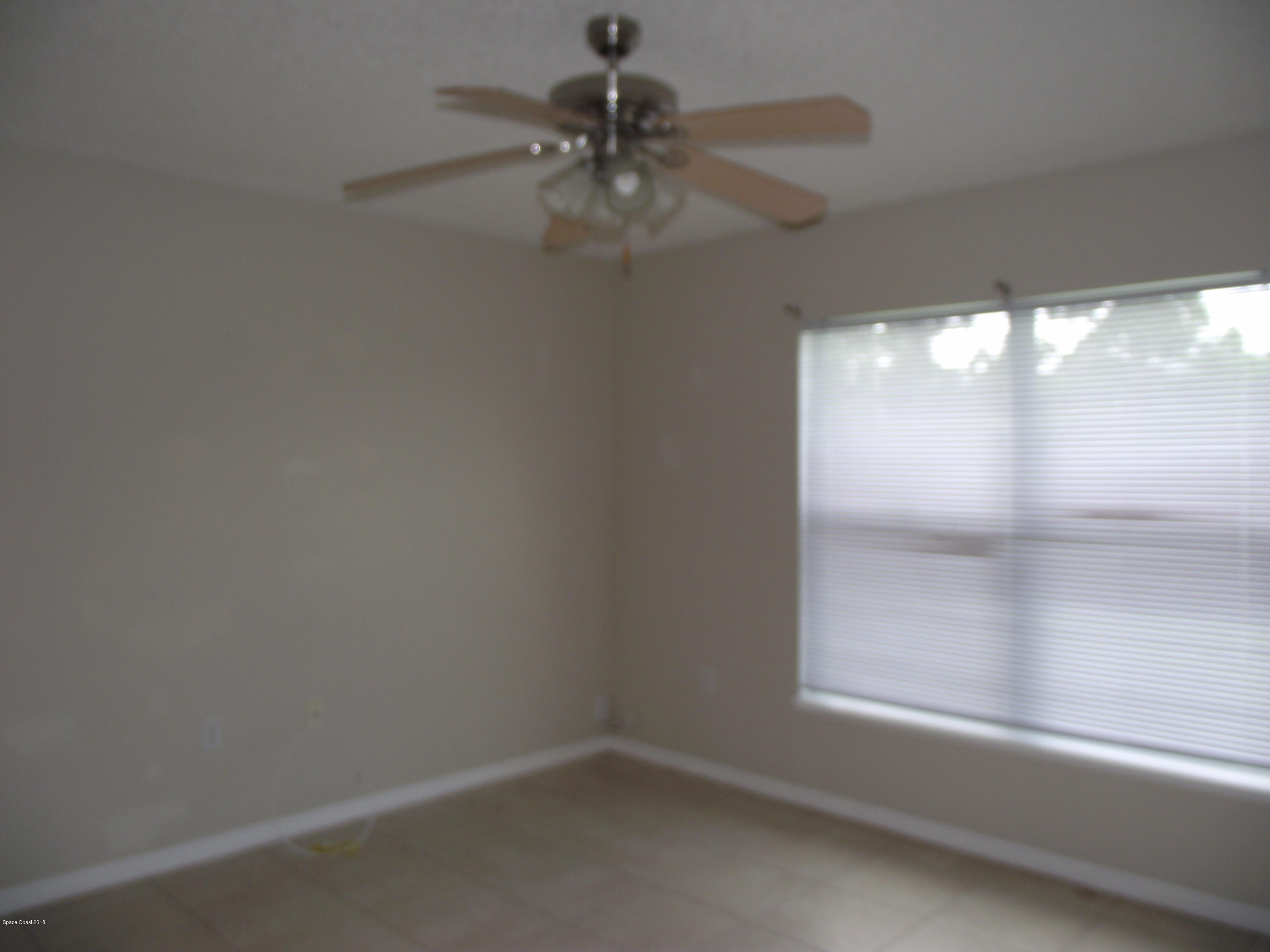 1006 Ray Road Southeast Palm Bay, FL 32909 - Photo 4 of 21 a view of a small space with a window