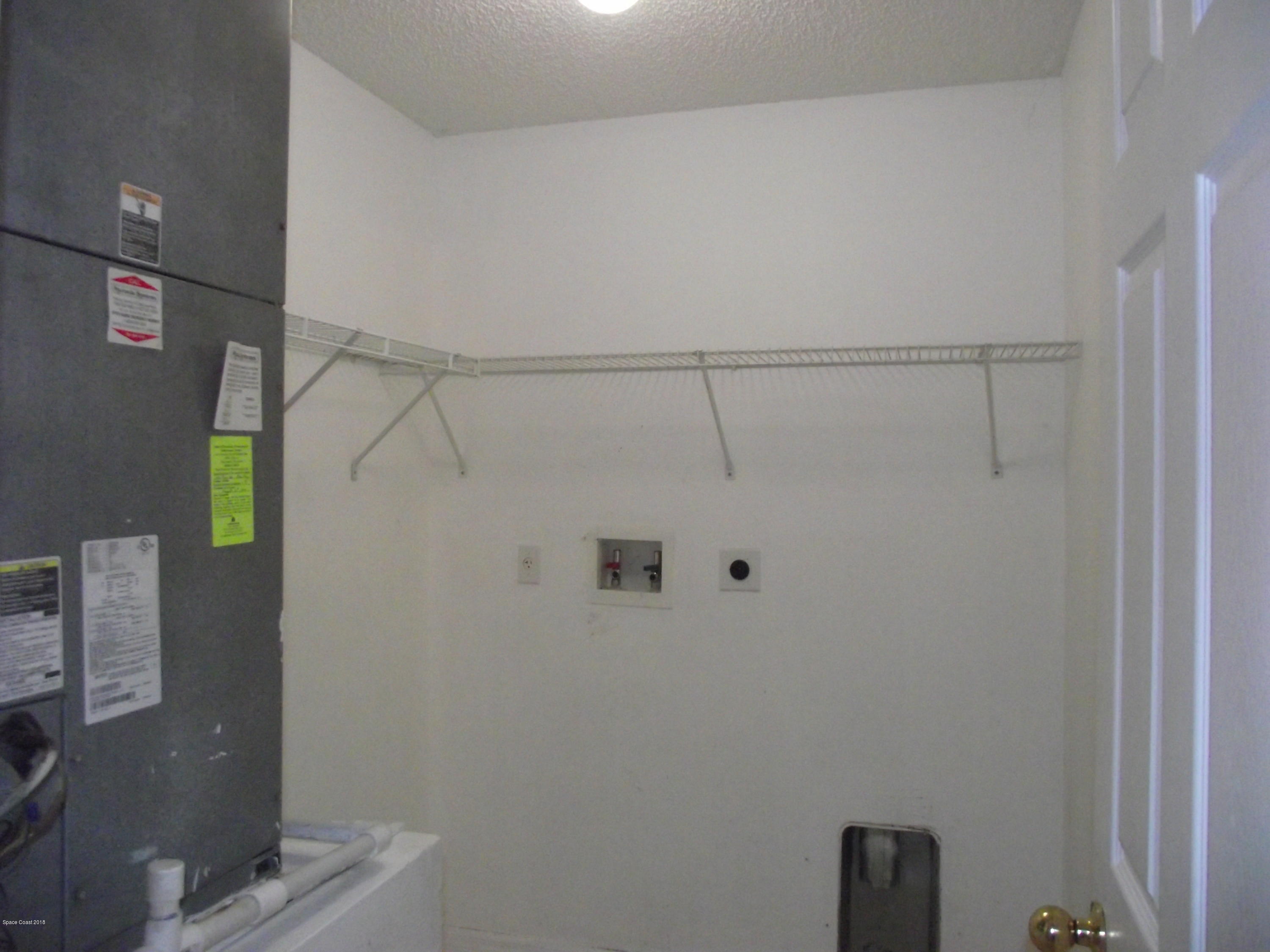 1006 Ray Road Southeast Palm Bay, FL 32909 - Photo 7 of 21 a view of a bathroom