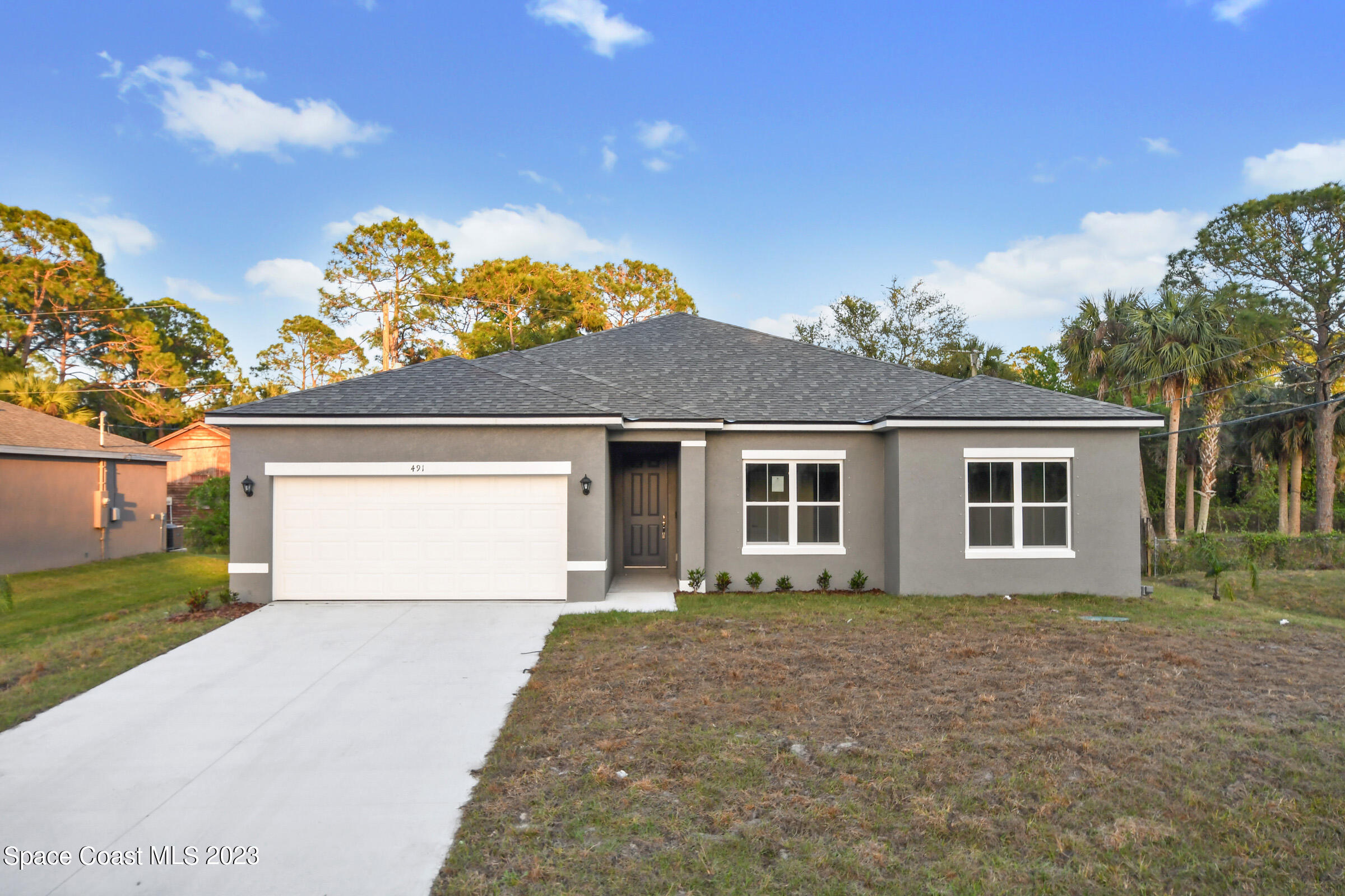 front view of a house with a yard