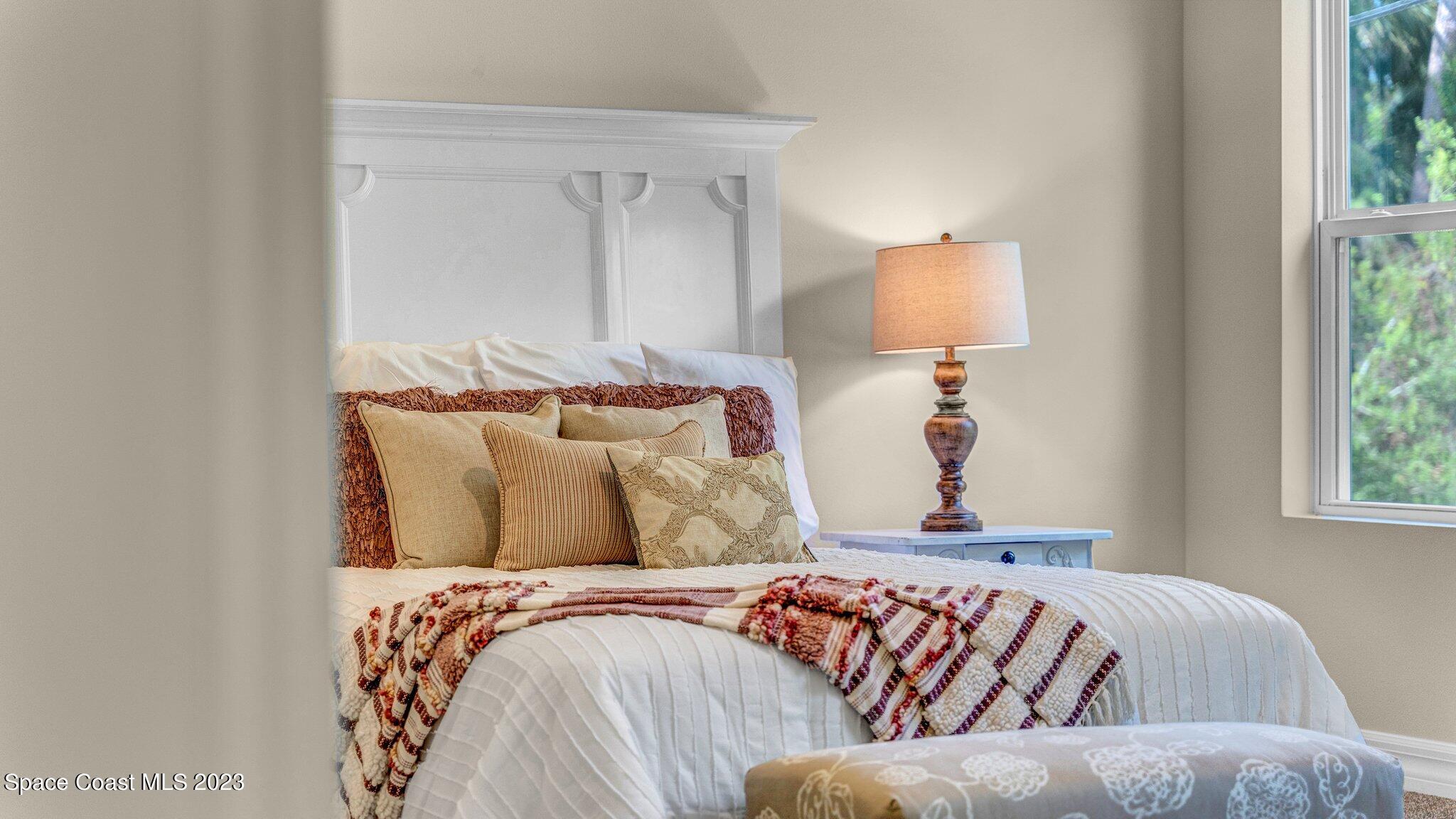 491 Tilhal Road Southwest Palm Bay, FL 32908 - Photo 14 of 30 a bedroom with a bed and window