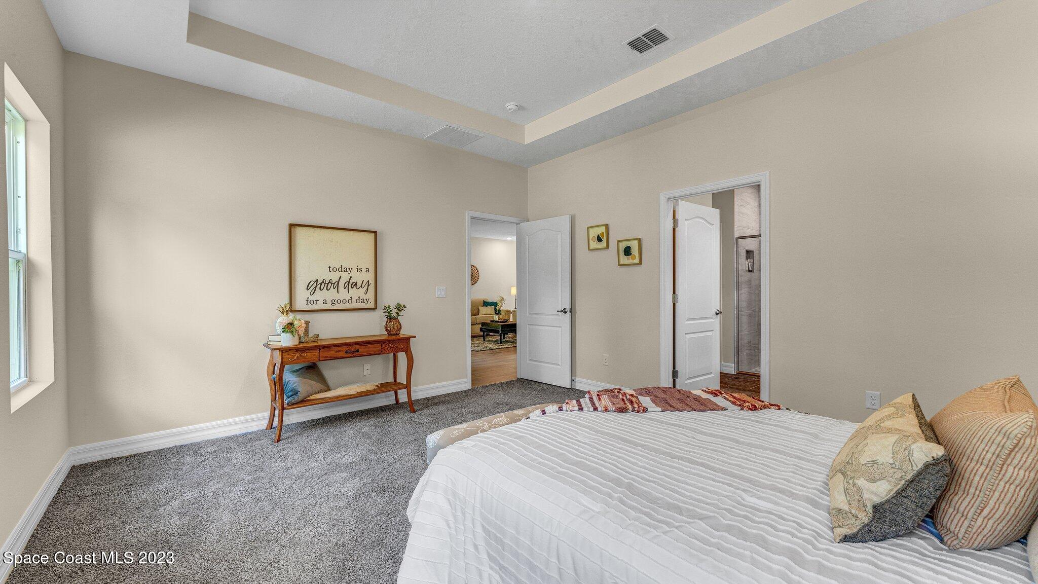 491 Tilhal Road Southwest Palm Bay, FL 32908 - Photo 16 of 30 a bedroom with a bed and a window