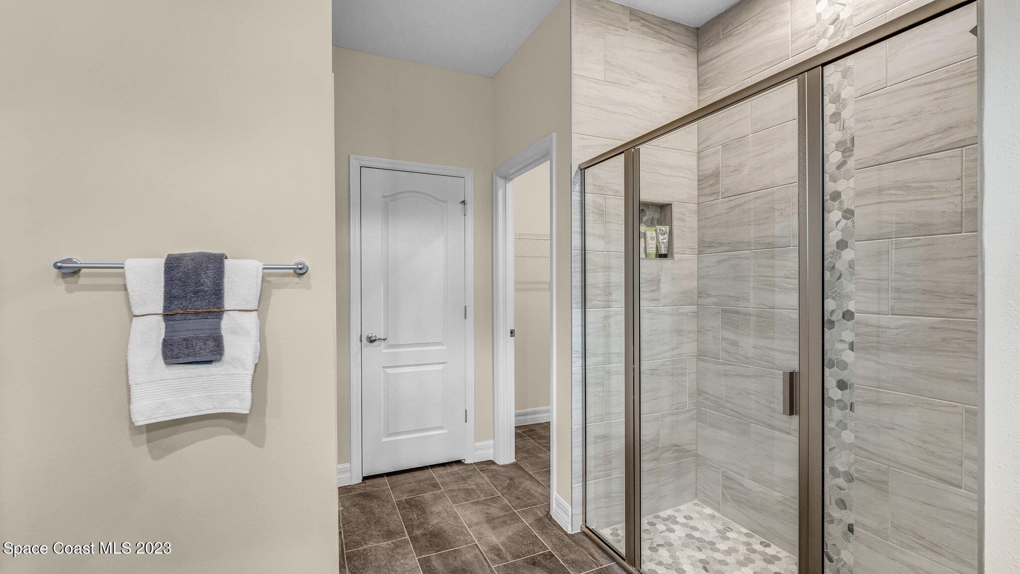 491 Tilhal Road Southwest Palm Bay, FL 32908 - Photo 19 of 30 a bathroom with a shower and a sink