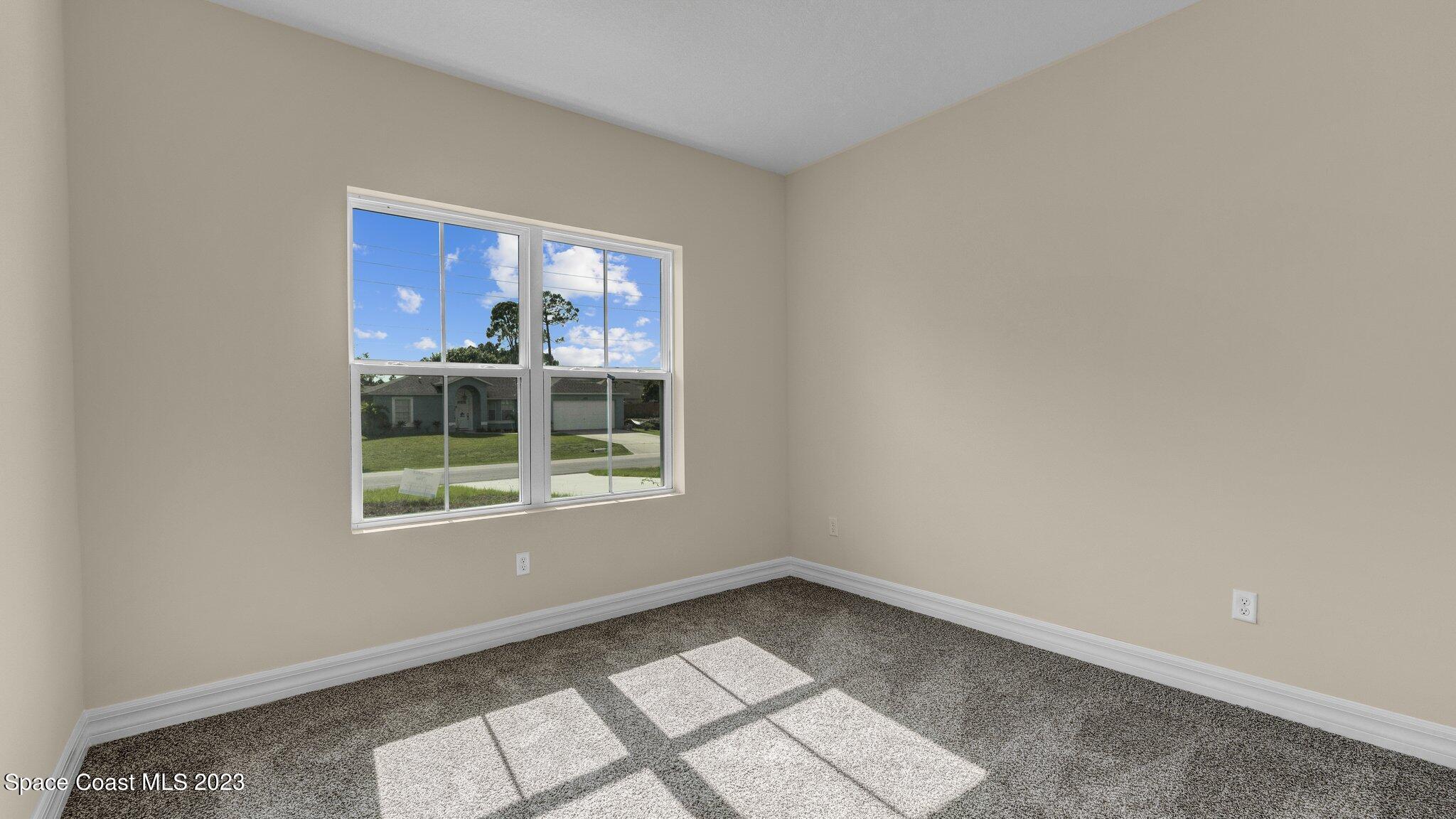 491 Tilhal Road Southwest Palm Bay, FL 32908 - Photo 24 of 30 a view of an empty room with a window