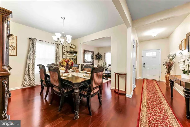 a view of entryway with livingroom and wooden floor