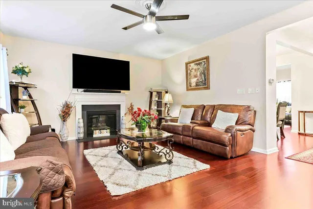 a large kitchen with kitchen island granite countertop wooden cabinets a counter top space and stainless steel appliances