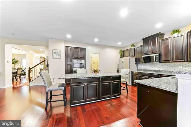 a bathroom with a sink mirror and vanity