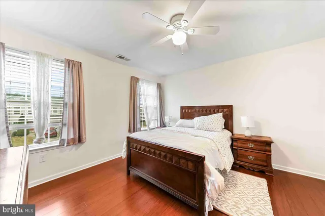 a bed room with a bed and a window