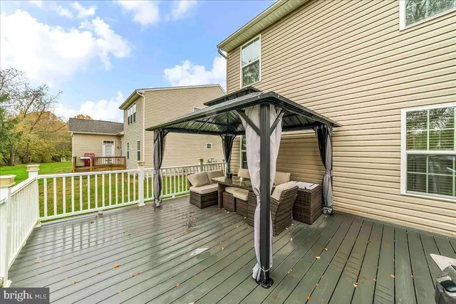 a view of a patio with a table chairs and a patio