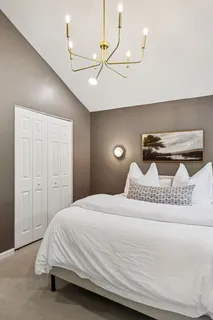 a bedroom with a bed and ceiling fan
