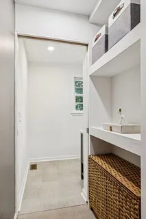 a bathroom with a sink a mirror and a shower