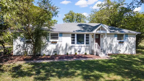 a backyard of a house with lots of green space