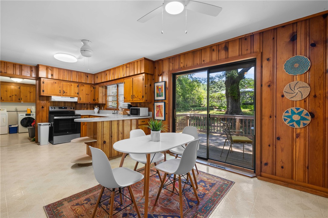 207 Brook Street Clemson, SC 29631 - Photo 12 of 39 A well-equipped kitchen offers a dining area and convenient access to the outdoor deck.