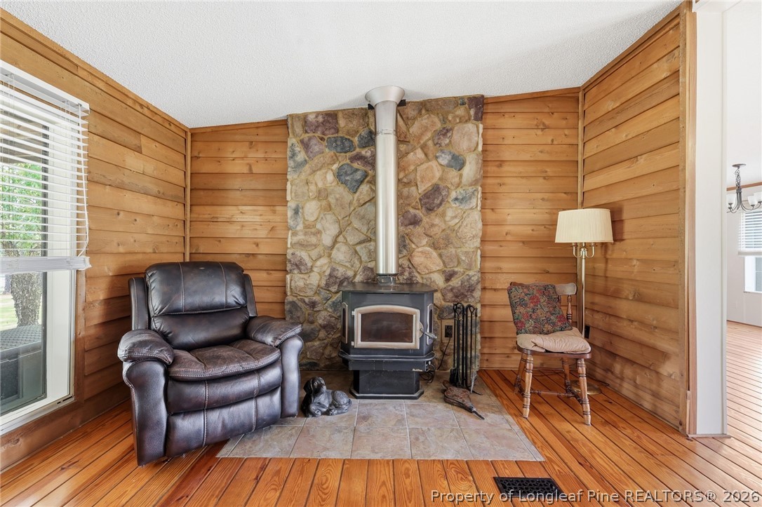 10400 Ruth Vinson Road Autryville, NC 28318 - Photo 23 of 49 a living room with furniture and a fireplace