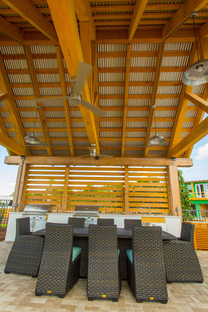75 York Lane, Unit 245 Inlet Beach, FL 32461 - Photo 34 of 41 a view of a patio with couches and table and chairs with wooden floor