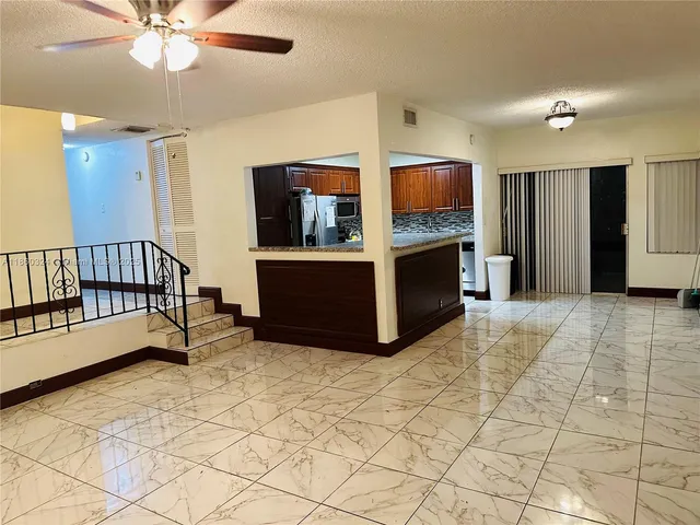 a living room with fireplace furniture and a flat screen tv