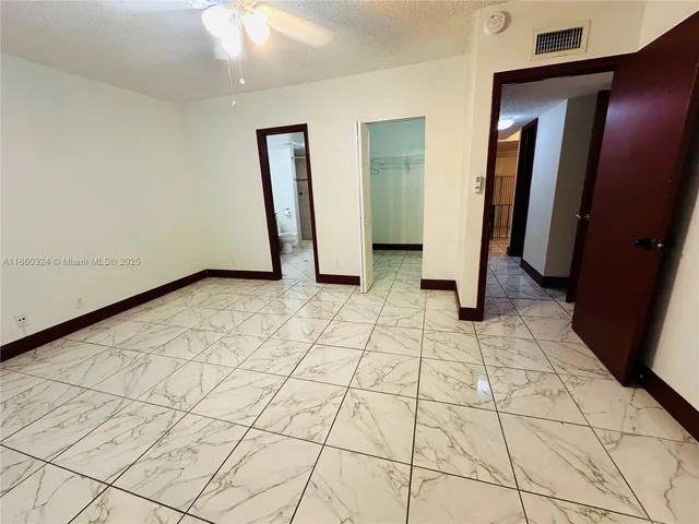 a view of a utility room with closet