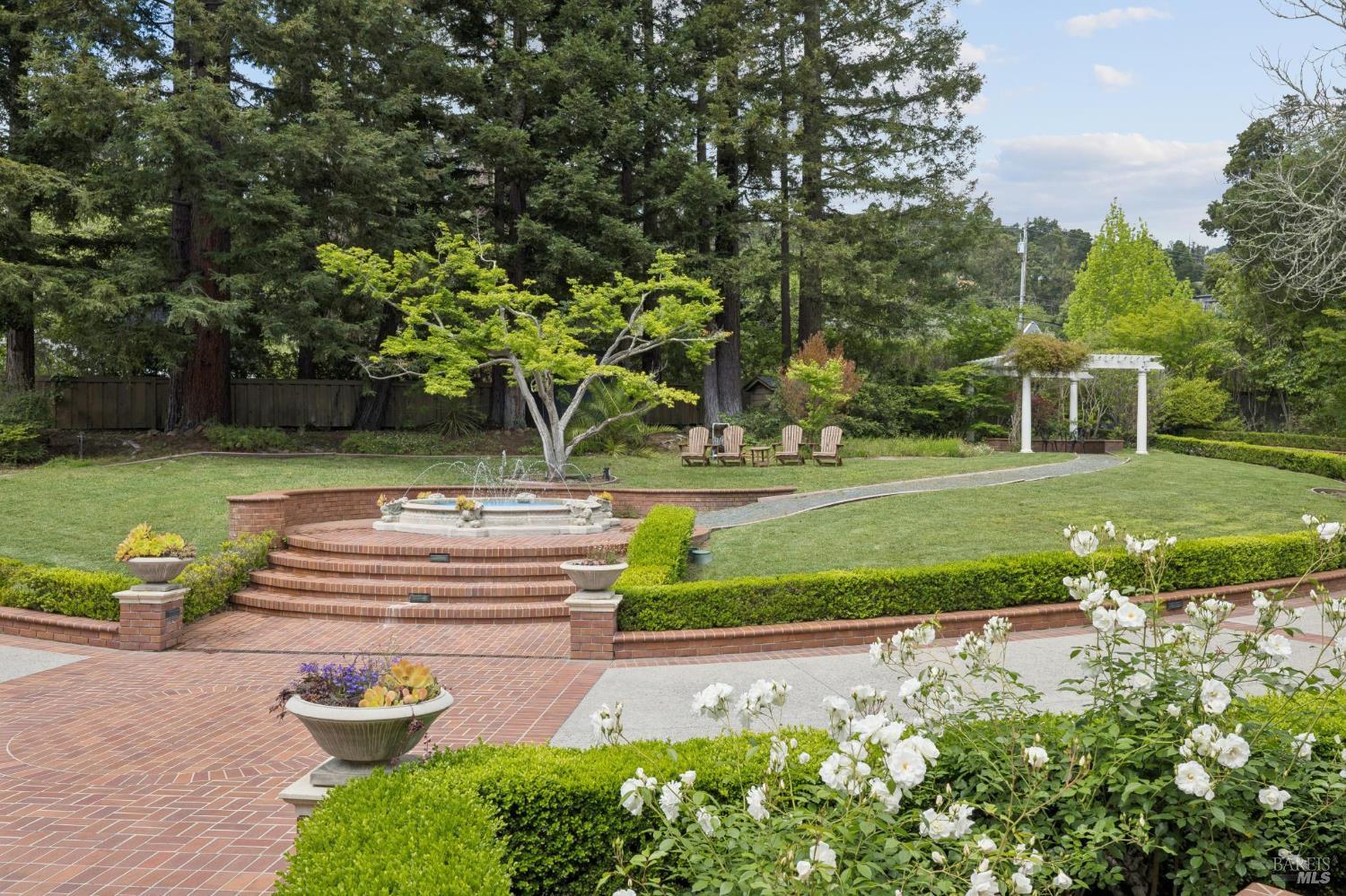 110 Mountain View Avenue San Rafael, CA 94901 - Photo 45 of 83 Expansive front lawn with a delightful fountain. The well and storage tank is hidden the redwood trees, can you see it?