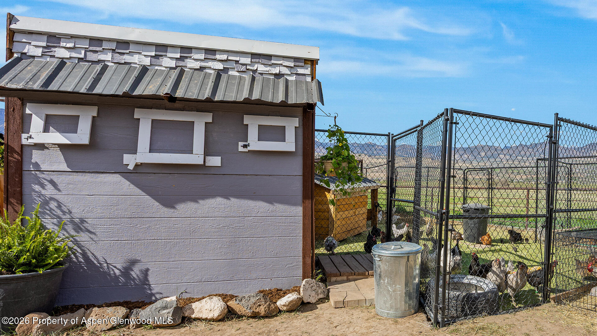 8877 County Road 320 Rifle, CO 81650 - Photo 13 of 51 a front view of a house with a fountain