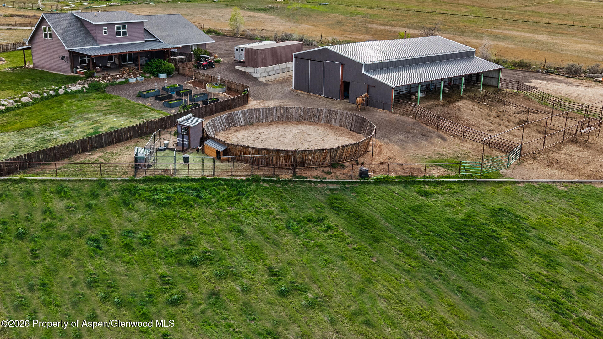 8877 County Road 320 Rifle, CO 81650 - Photo 2 of 51 an aerial view of a house with a garden and lake view
