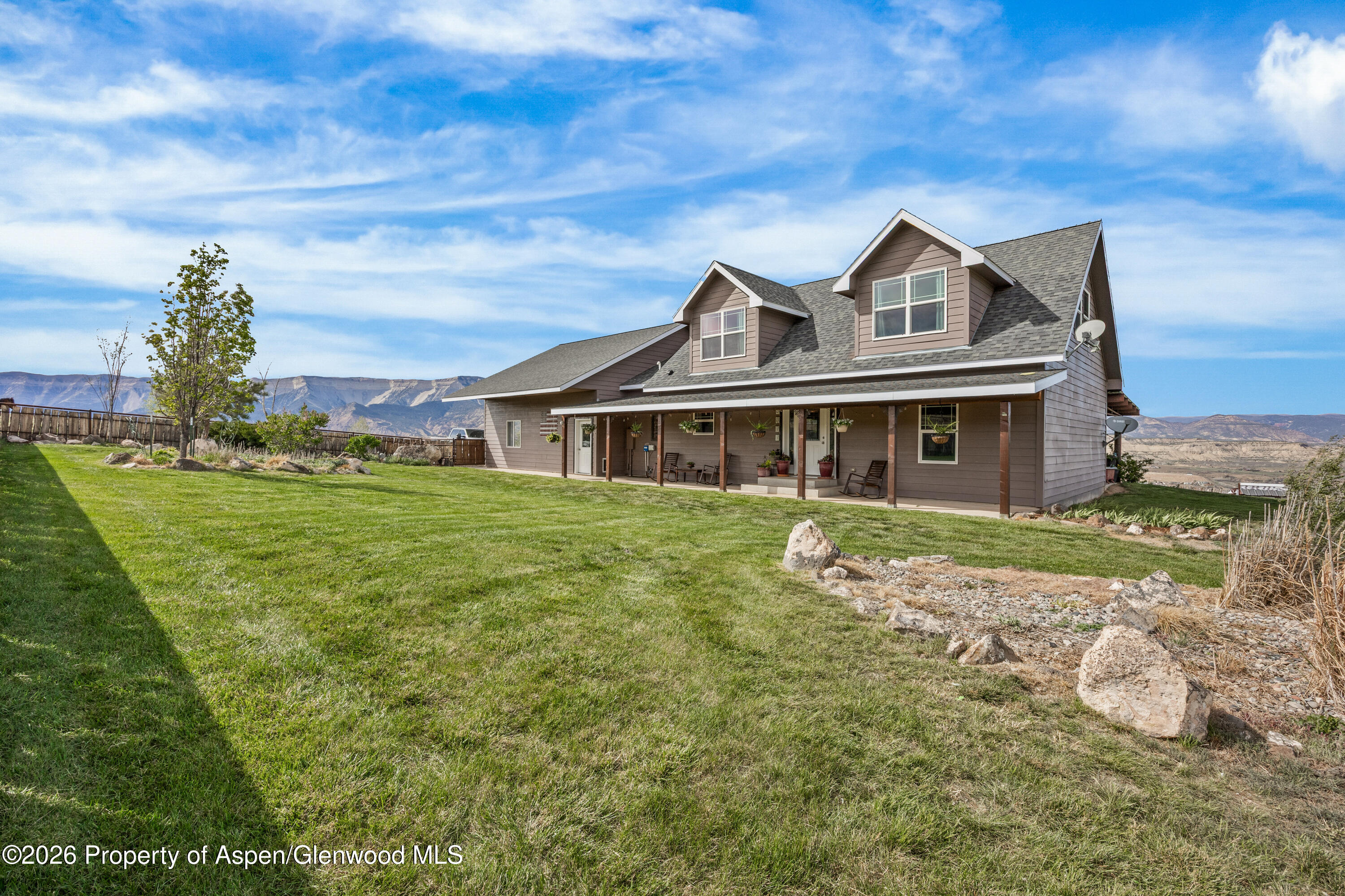 8877 County Road 320 Rifle, CO 81650 - Photo 30 of 51 a front view of a house with a yard