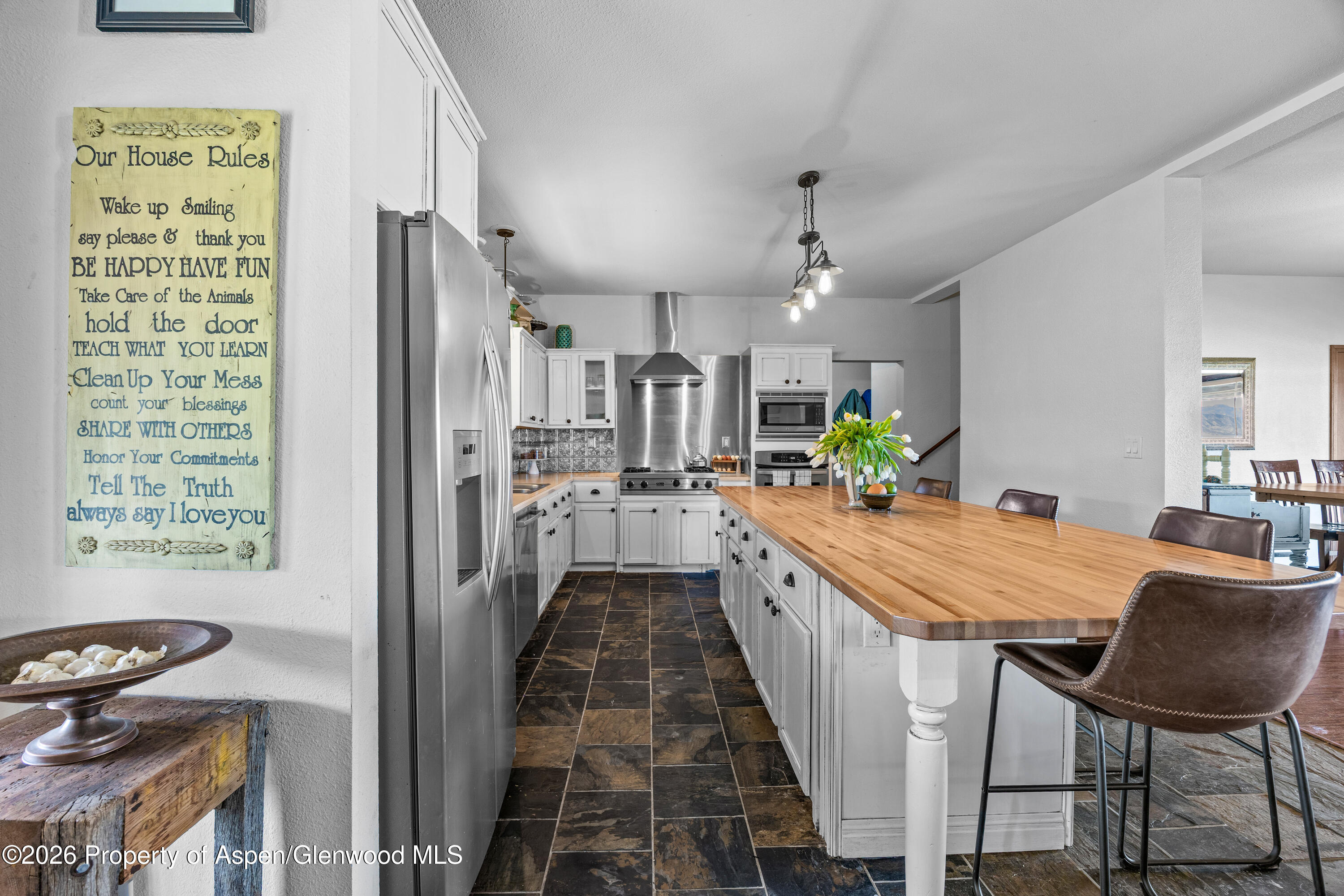 8877 County Road 320 Rifle, CO 81650 - Photo 33 of 51 a large kitchen with a table and chairs