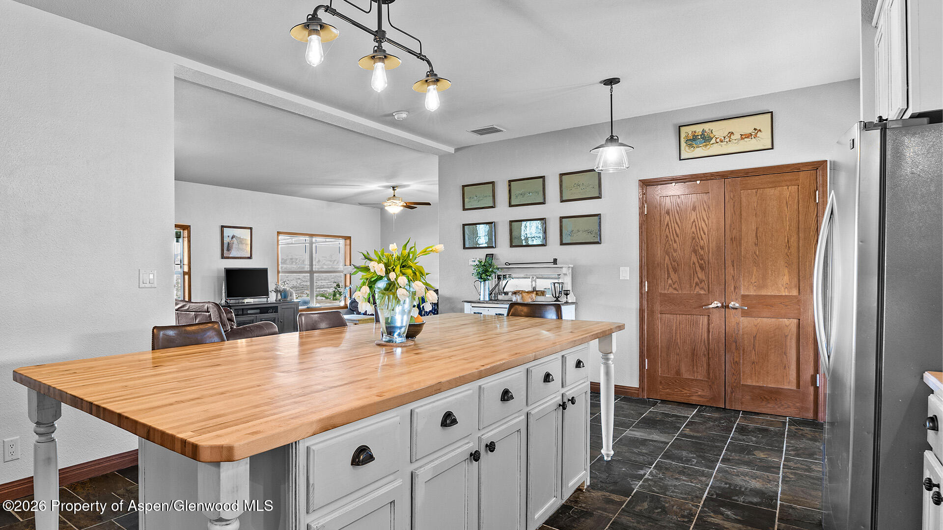 8877 County Road 320 Rifle, CO 81650 - Photo 35 of 51 a kitchen with center island table and chairs