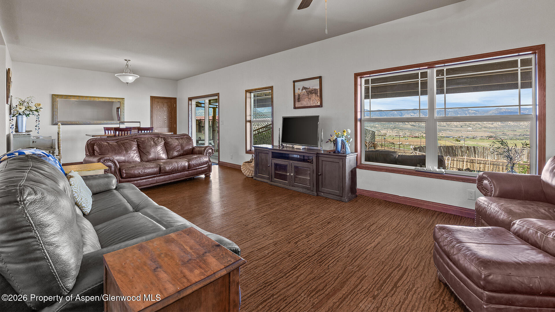 8877 County Road 320 Rifle, CO 81650 - Photo 39 of 51 a living room with furniture window and a flat screen tv
