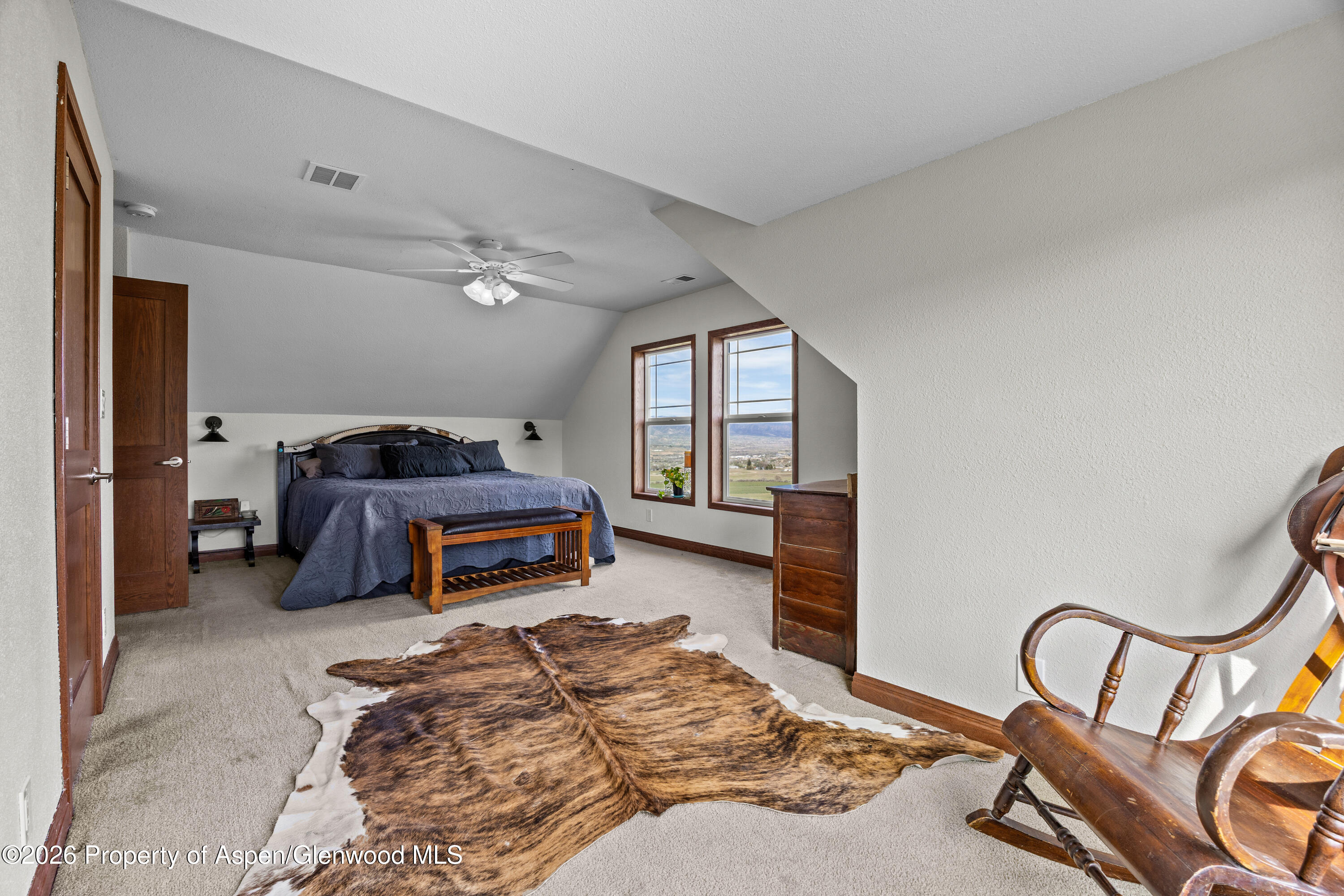8877 County Road 320 Rifle, CO 81650 - Photo 42 of 51 a bedroom with furniture and a window
