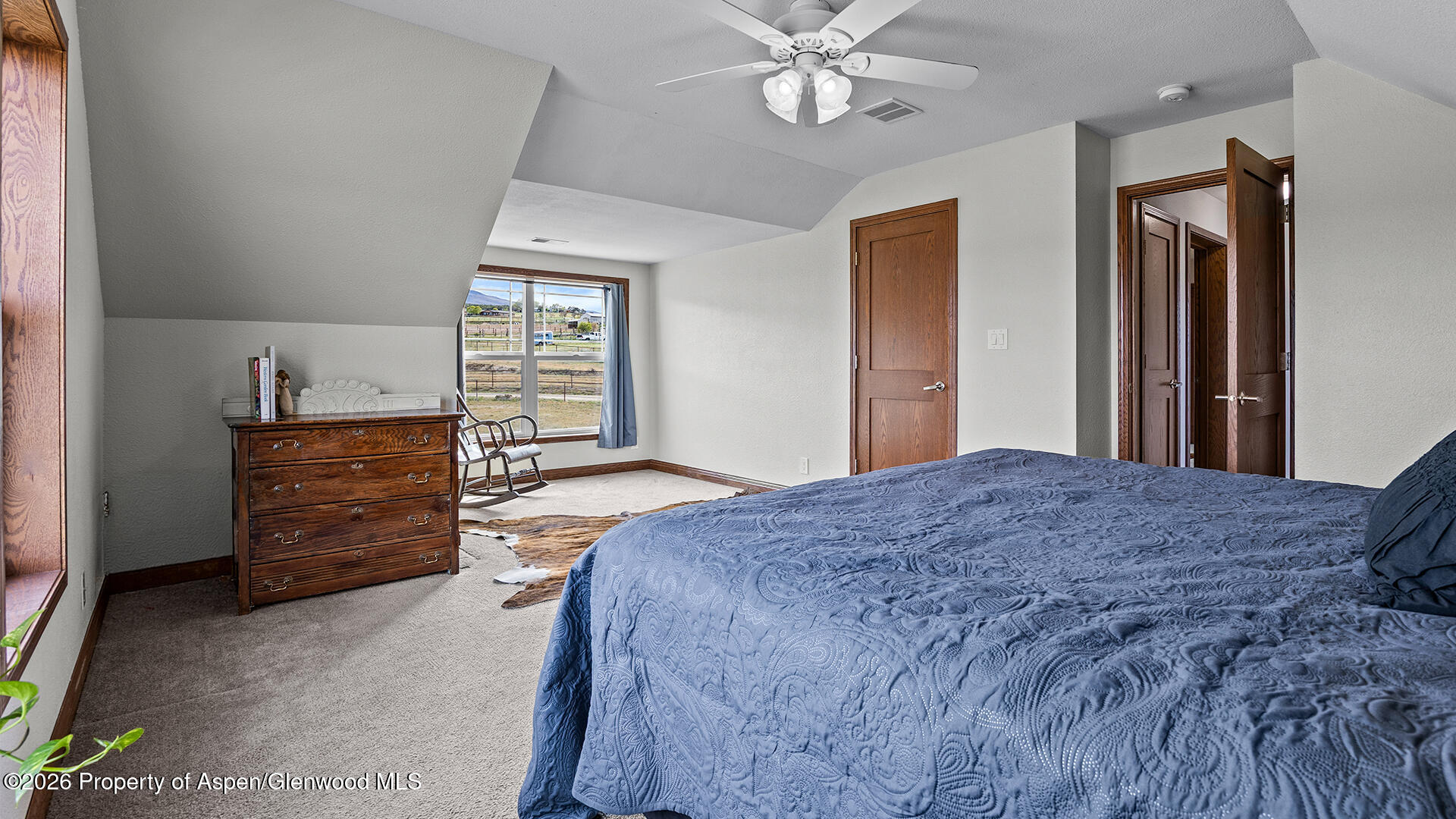 8877 County Road 320 Rifle, CO 81650 - Photo 43 of 51 a bedroom with a bed and furniture