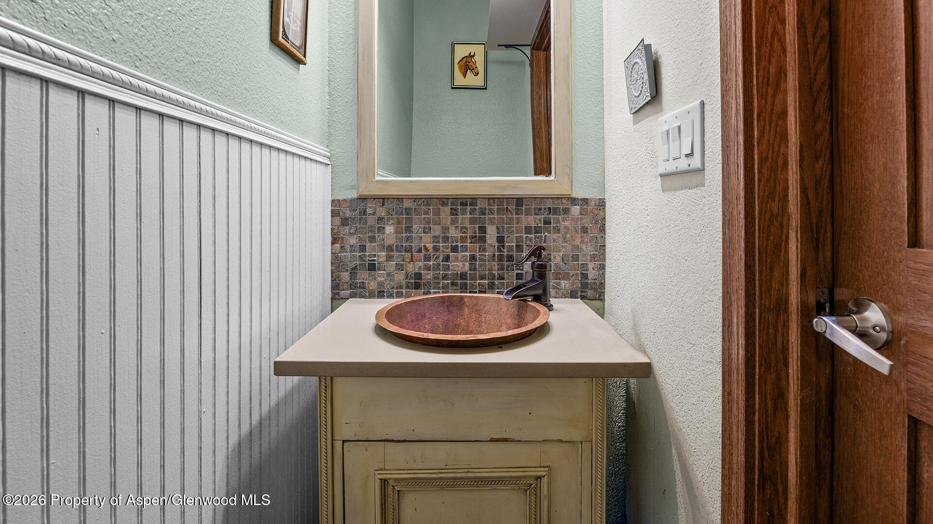 8877 County Road 320 Rifle, CO 81650 - Photo 44 of 51 a bathroom with a sink and a mirror