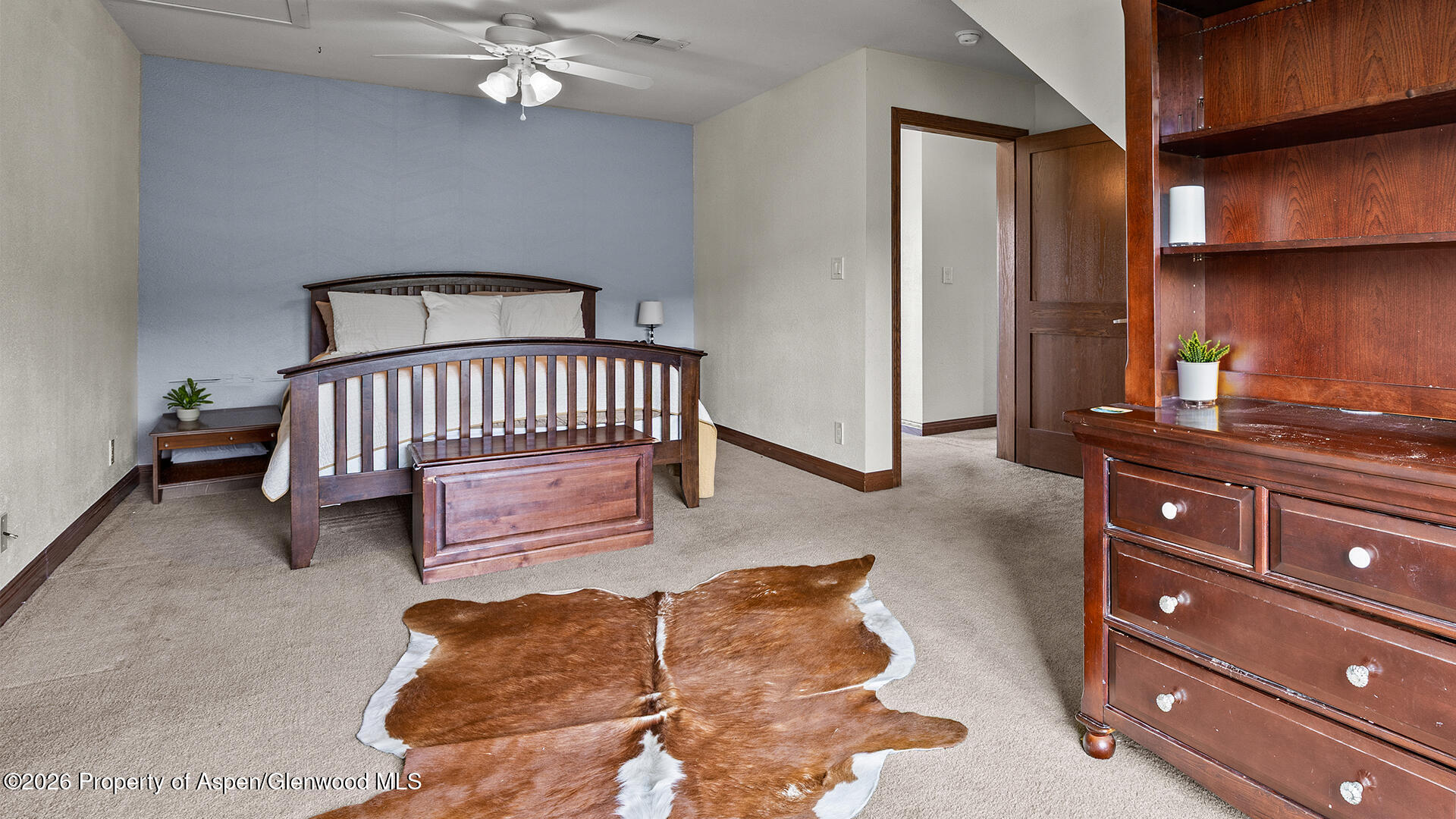 8877 County Road 320 Rifle, CO 81650 - Photo 45 of 51 a bedroom with a bed and dresser