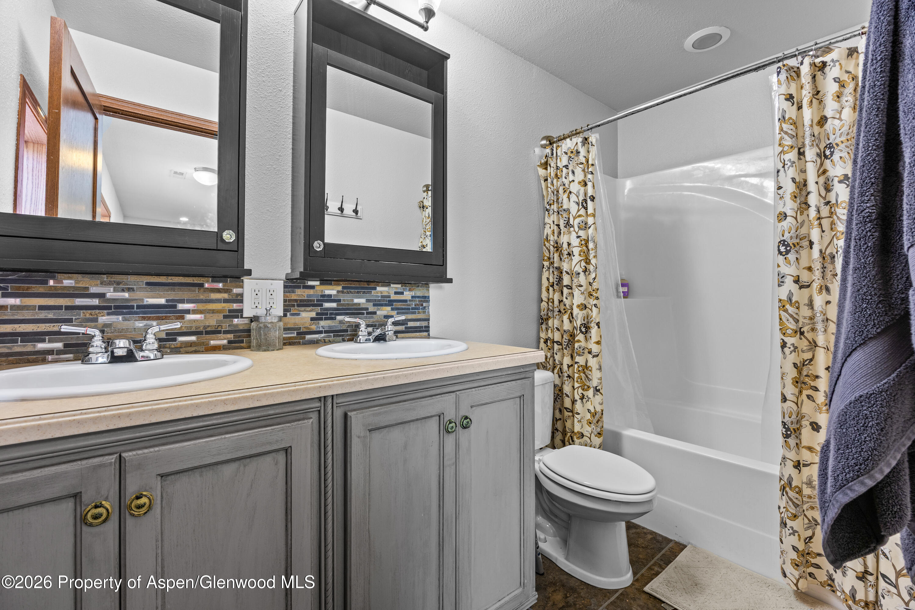 8877 County Road 320 Rifle, CO 81650 - Photo 47 of 51 a bathroom with a sink a toilet and shower