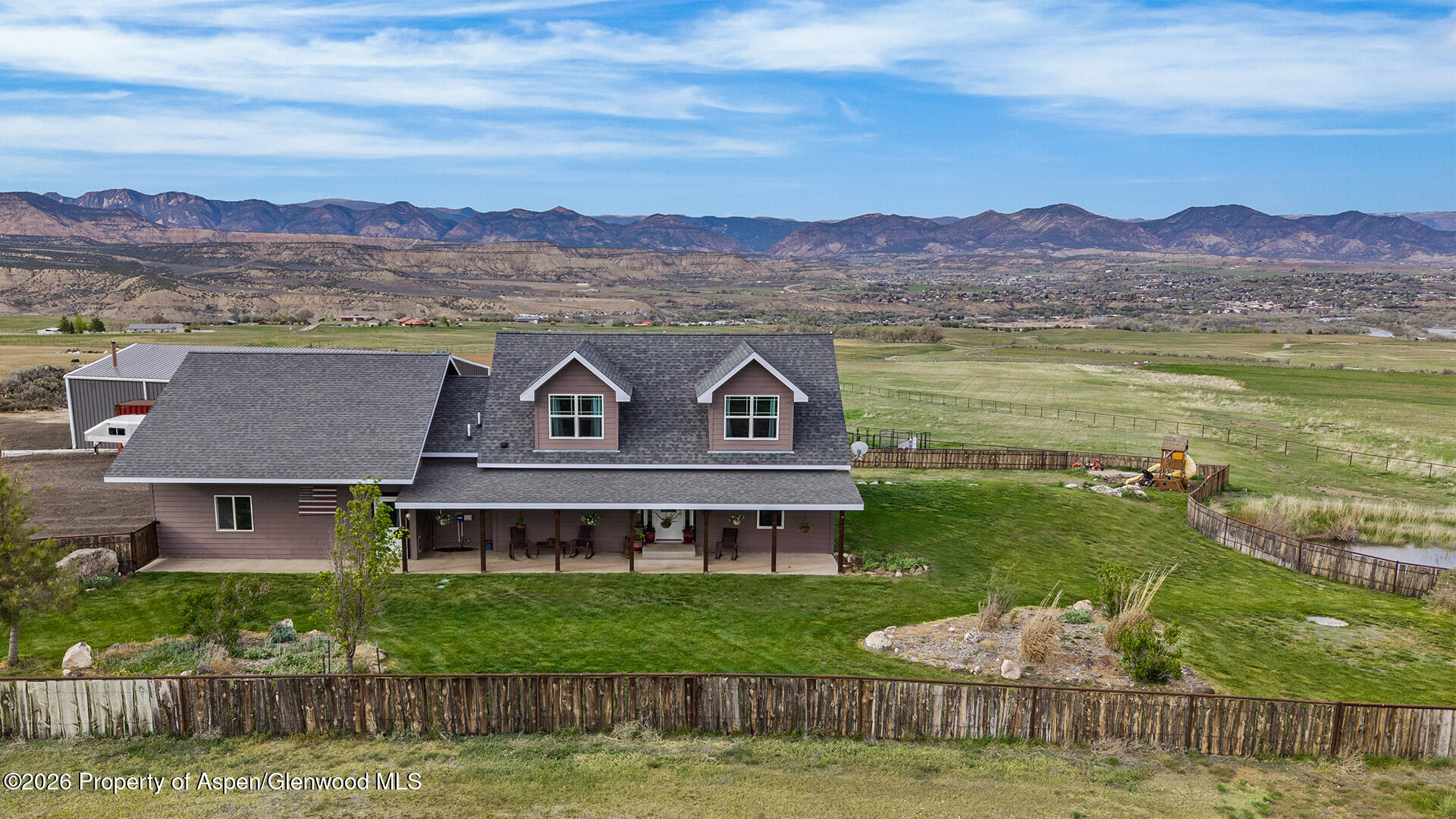 8877 County Road 320 Rifle, CO 81650 - Photo 6 of 51 a front view of a house with a garden and a mountain
