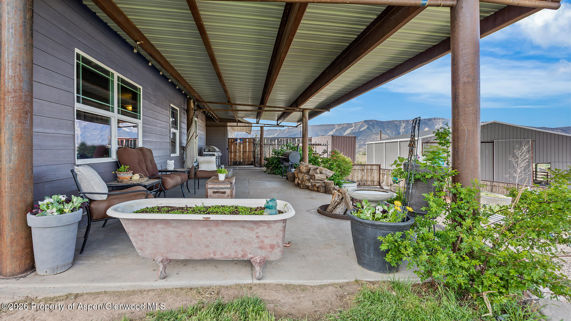 8877 County Road 320 Rifle, CO 81650 - Photo 10 of 51 a view of a balcony with chair and potted plants