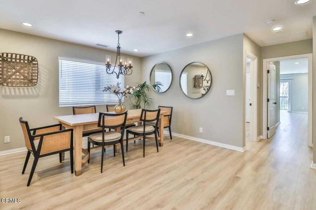 1030 Canal Street Oxnard, CA 93035 - Photo 12 of 26 a view of a dining room with furniture window and wooden floor