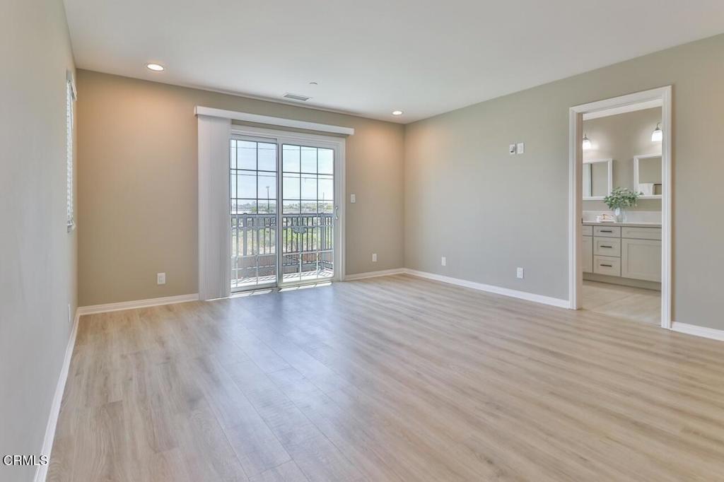 1030 Canal Street Oxnard, CA 93035 - Photo 14 of 26 wooden floor in an empty room with a window